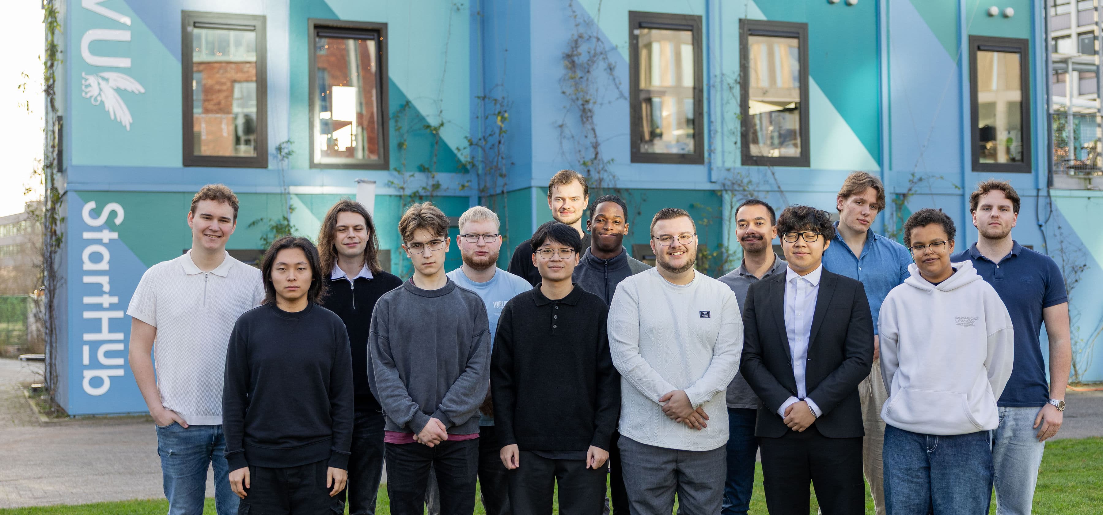 Group of people smiling and collaborating outdoors